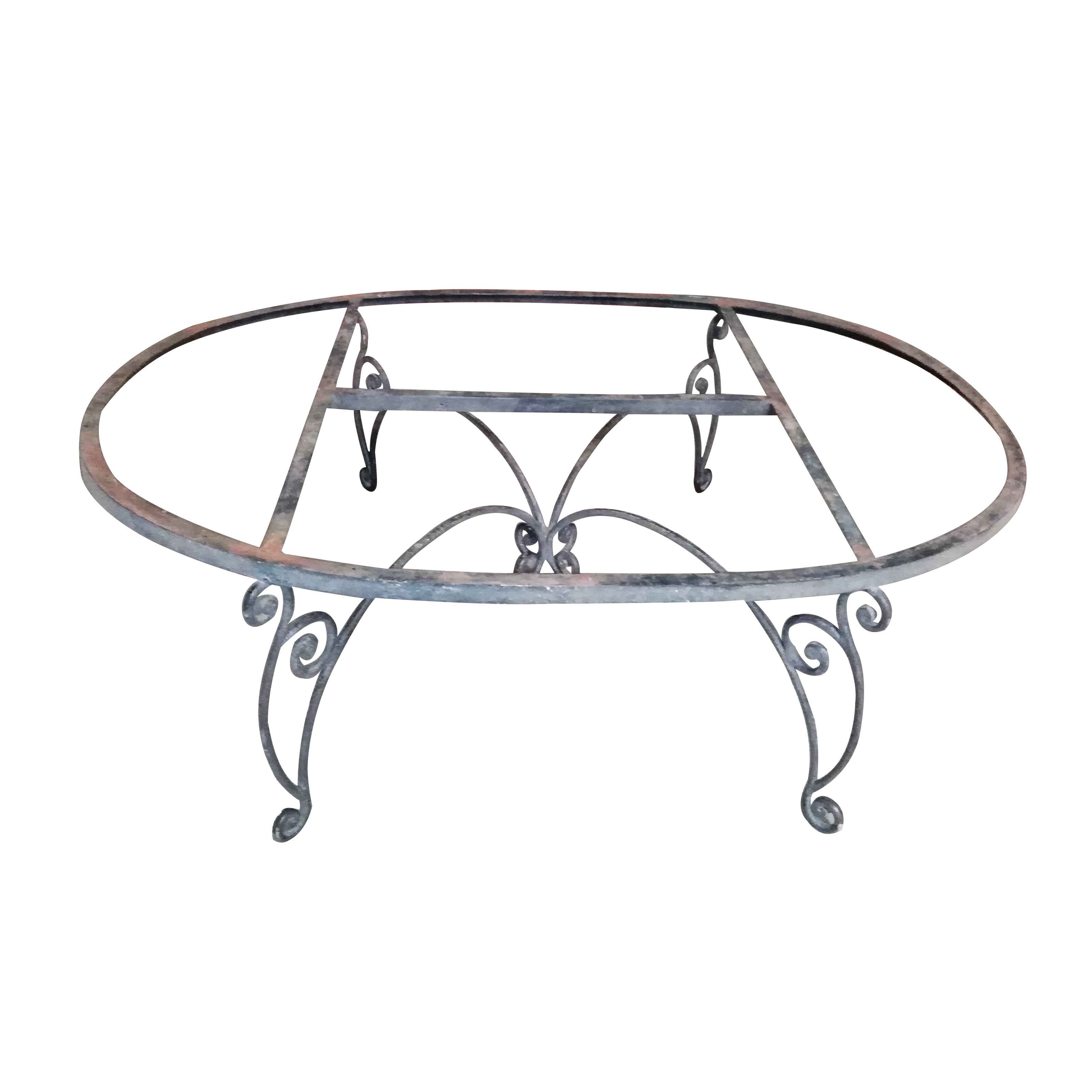 Mesa de centro oval en acero con soportes a manera de roleo