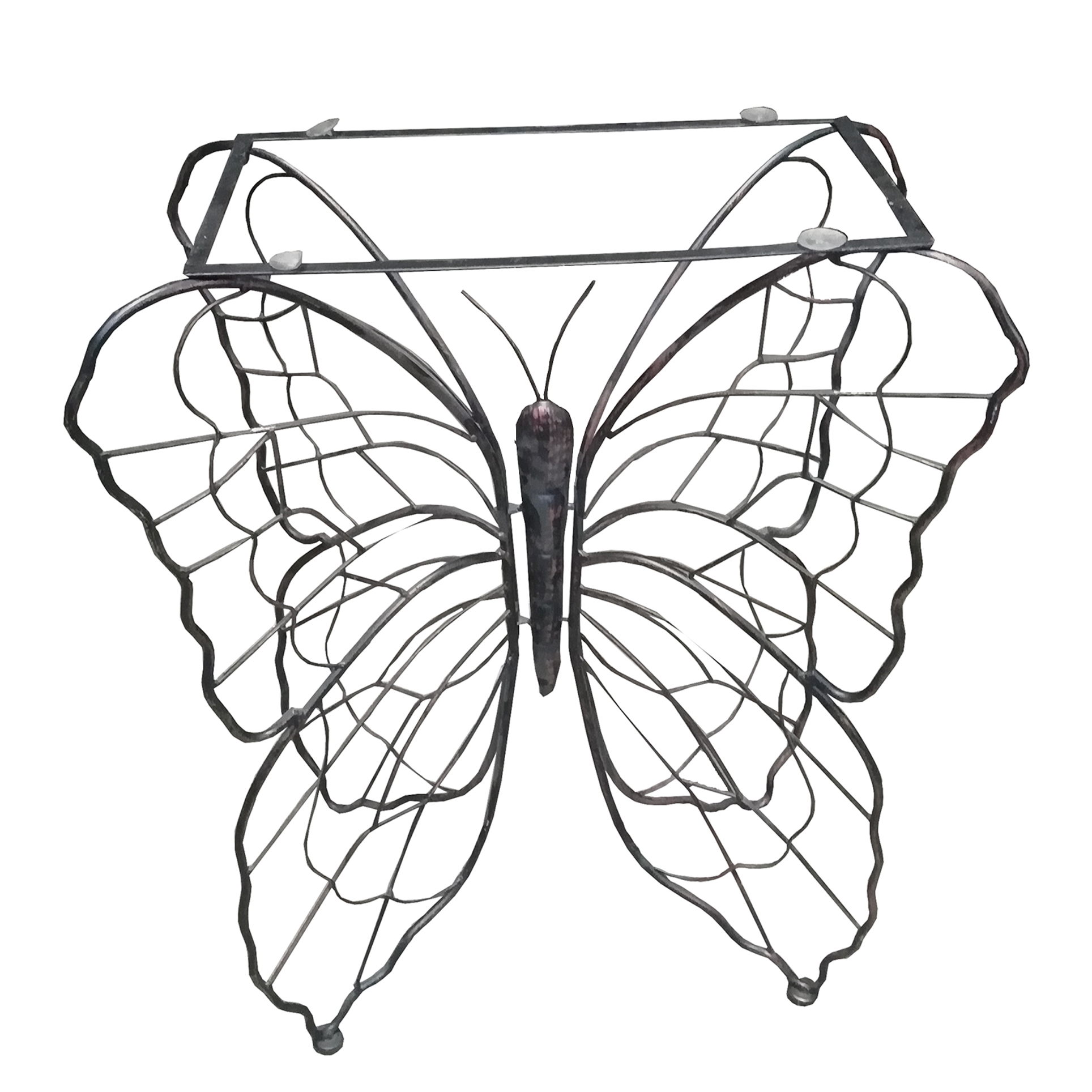 Mesa de hall a manera de mariposa en hierro y vidrio